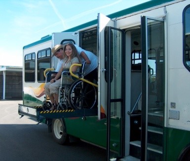 Person in wheelchair using a bus lift