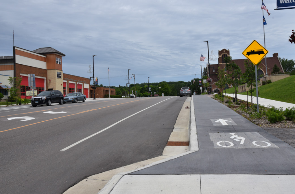 Hwy 28 (Minnesota Ave.) in downtown Glenwood, showing lane adjustment, raised cycletrack, and landscaping