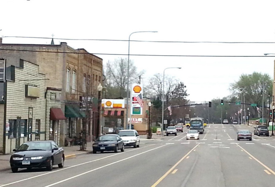 Highway 21 in downtown Jordan after construction, showing narrower lanes, bike lanes, and an improved crosswalk