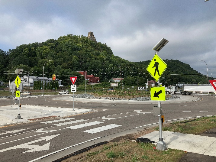 A roundabout along Hwy 43 in Winona after construction showing a crosswalk and an RRFB