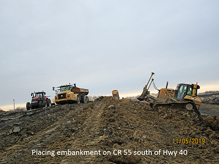 Placing embankment on County Road 55 south of Highway 40