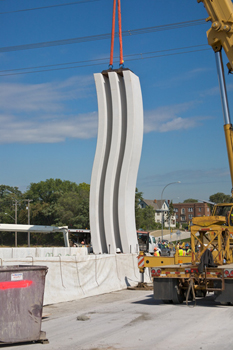 Two 30 foot tall gateway elements being installed in the median of the bridge to mark the crossing of the Mississippi River in 2008