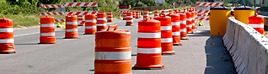 Orange barrels on a highway