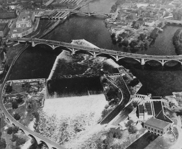 Aerial view of St. Anthony Falls and three bridges over the Mississippi. From top to bottom: Hennepin Avenue, Third Avenue, Stone Arch