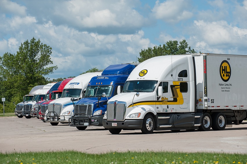 semi trucks parked side by side