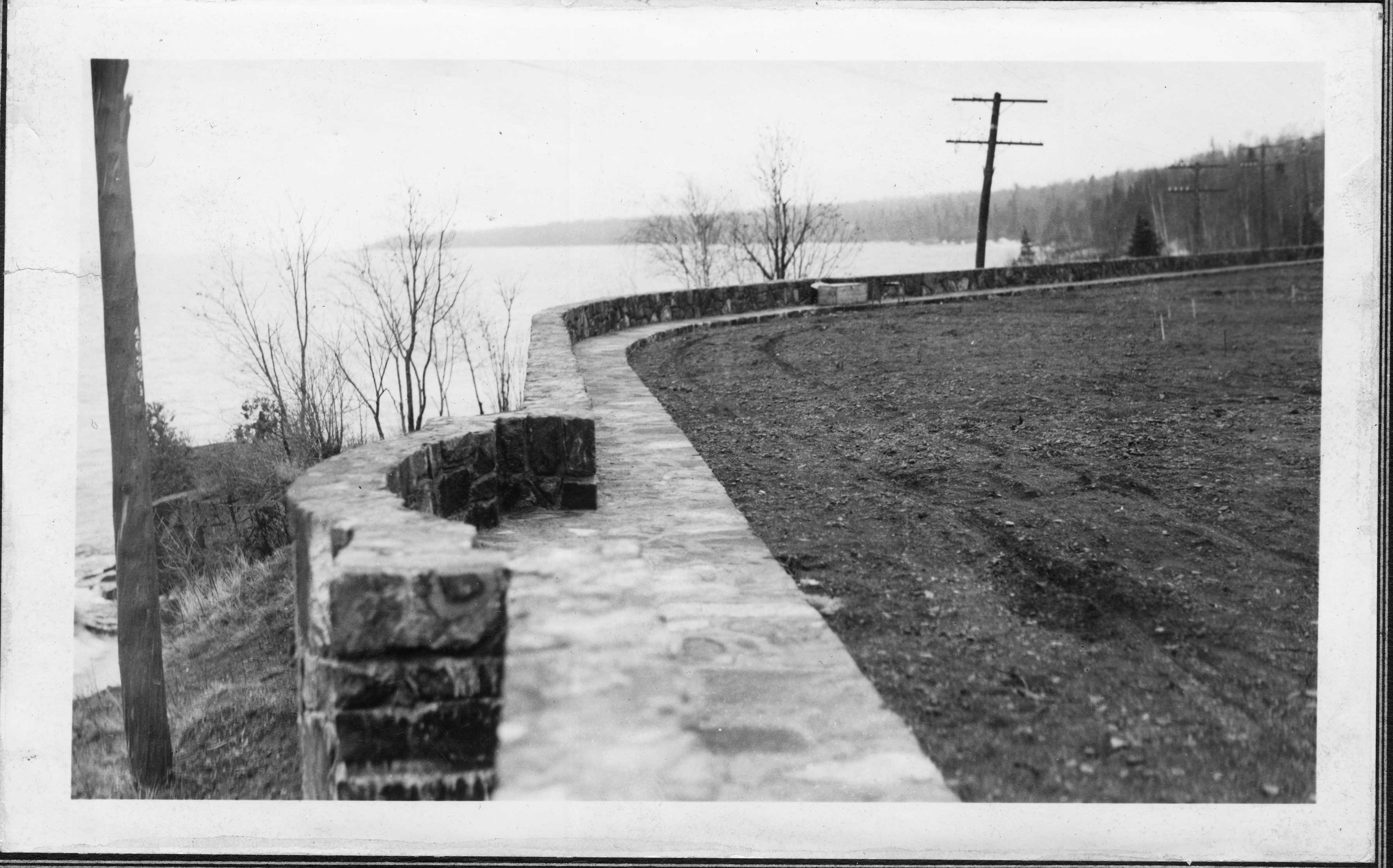 The flagstone walk and wall overlook, looking south. Notice the drive is not yet paved.
