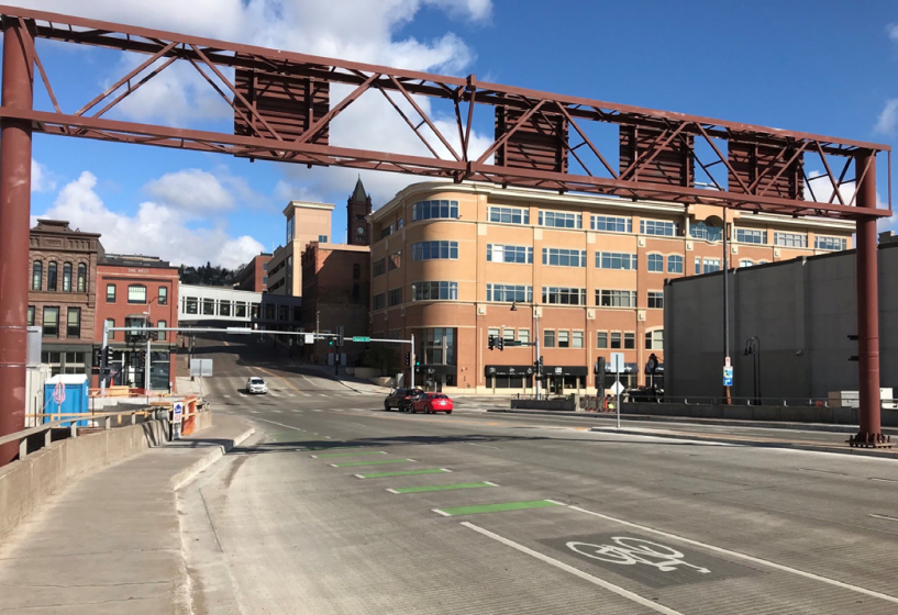 Lake Avenue bridge over Hwy 35 after construction, showing green-striped bike lanes, wider sidewalk, and lane reduction.