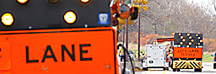 Orange barrels on a highway