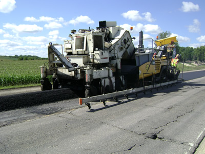 Paver flattening the asphalt