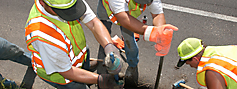 construction workers digging to repair the highway