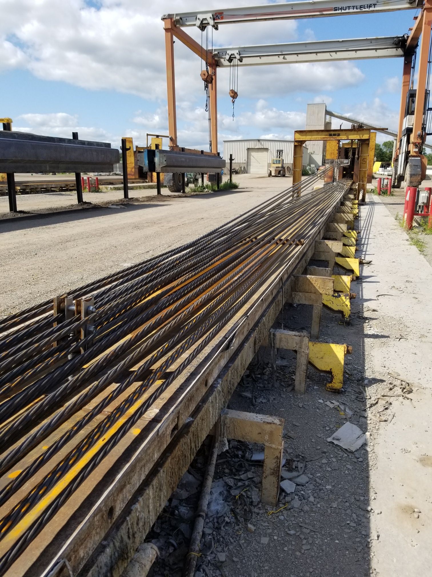 Some prestressing strands are draped to reduce the strand eccentricity at the ends of the beams. This process is time-consuming, costly and challenging for fabricators.