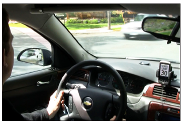 The TDSS app posts the speed limit on the screen of a dash-mounted smartphone.