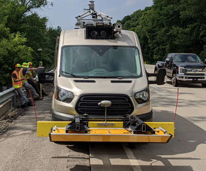 A van with a 3D GPR device attached to the front of the vehicle.