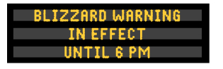 A blizzard warning appears in yellow text on a Dynamic Message Sign.