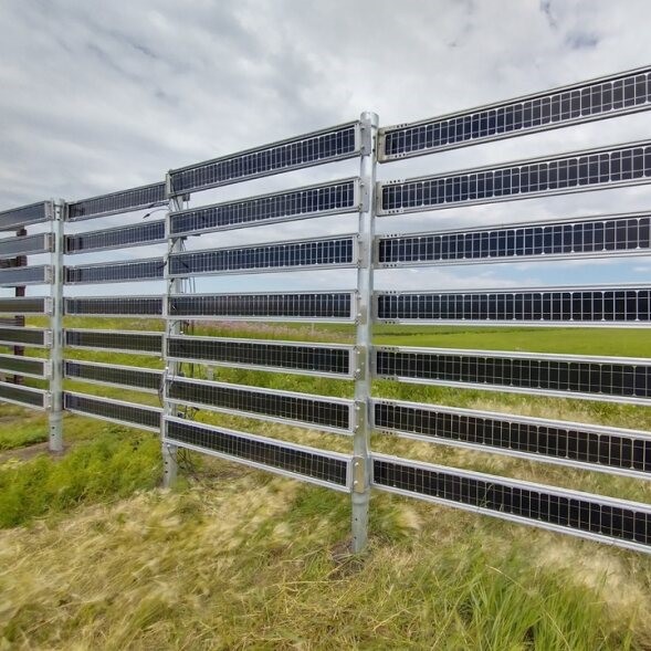photo of fence made of narrow solar panels
