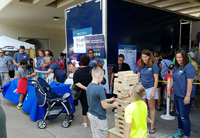 Children playing with giant Jenga set at STEM Day at the Minnesota State Fair